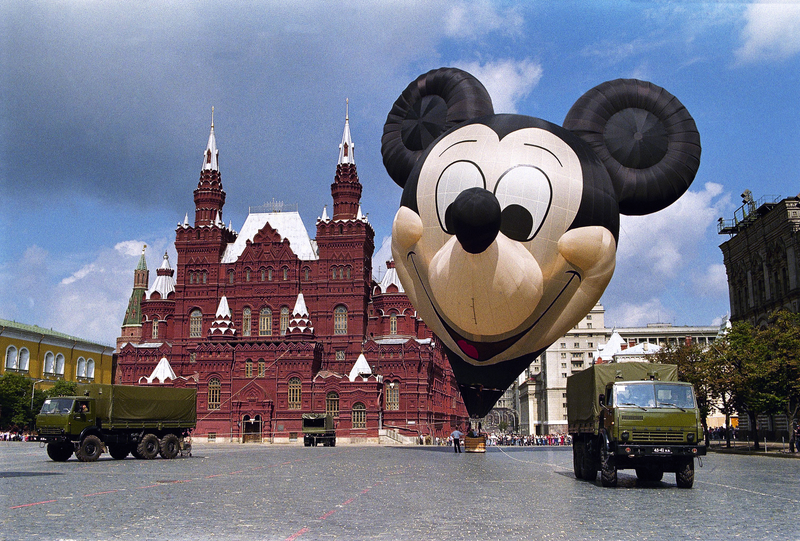 A giant Mickey Mouse hot-air balloon, over four stories high, is inflated in Moscow’s Red Square on Sunday, July 21, 1991, as a prop in a Circle Vision’s latest film for the new Euro Disney resort which is scheduled to open Spring 1992 near Paris. (AP Photo/Olga Shalygin)